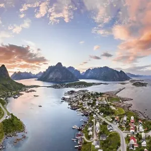 Aerial view, sunset at Reinefjord with mountains Aerial view, sunset at Reinefjord with mountains