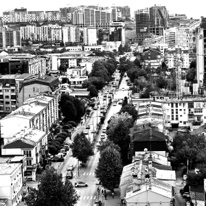 Aerial view of an urban environment with high-rise buildings and roads in black and white