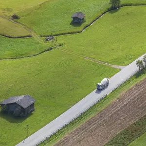 Alm with hay barn and country road Alm with hay barn and country road