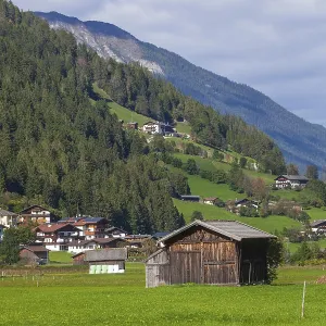 Alm with hay barn and mountains Alm with hay barn and mountains