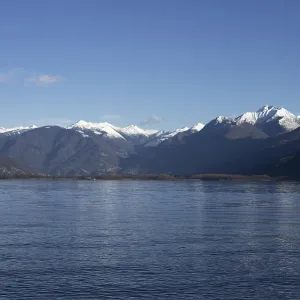 Alpine lake Lago Maggiore, snow-capped mountain Alpine lake Lago Maggiore, snow-capped mountain