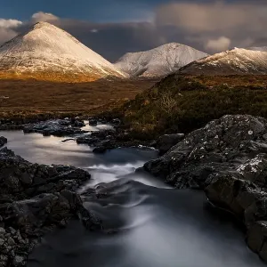 AltDearg Mor with snow-covered peaks of the Cullins Mountains in Highland landscape AltDearg Mor with snow-covered peaks of the Cullins Mountains in Highland landscape