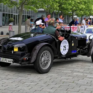 Alvis Crested EAGLE, black classic car with rally driver on a cobblestone road during an event