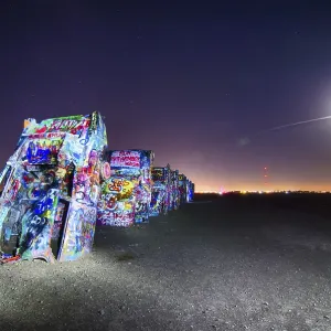AMARILLO, TEXAS - April 2015: Famous art installation Cadillac Ranch at night AMARILLO, TEXAS - April 2015: Famous art installation Cadillac Ranch at night