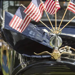 American flags on hood ornament of classic vintage car American flags on hood ornament of classic vintage car