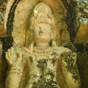 Ancient Bodhisattva statue carved in rock at Kushtarajagala site in Weligama Sri Lanka spiritual heritage site with