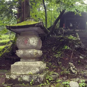 Ancient stone lantern structure in Japanese temple yard in Nikko Ancient stone lantern structure in Japanese temple yard in Nikko