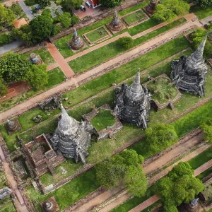 An ancient temple complex next to a city and a modern temple An ancient temple complex next to a city and a modern temple