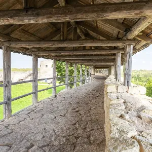 Ancient weathered rough stone walls and tower of the Izborsk fortress Ancient weathered rough stone walls and tower of the Izborsk fortress