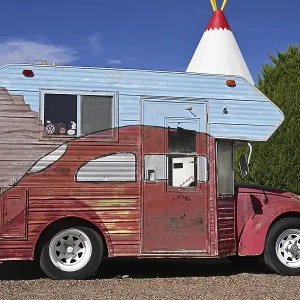 Antique VW Beetle camper adorns the backyard of the Wigwam Motel on Route 66