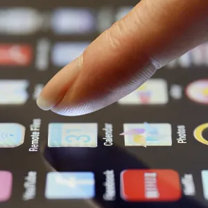 App being selected by a finger on a touchscreen App being selected by a finger on a touchscreen