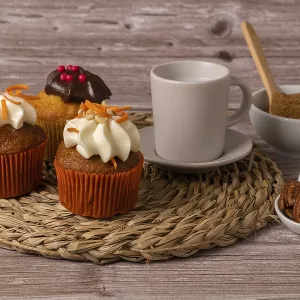 Assortment of chocolate and cream and carrot cupcakes on various backgrounds
