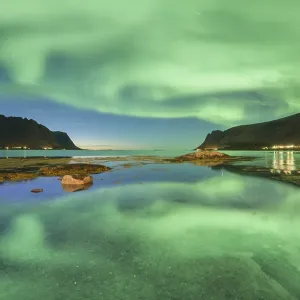 Aurora borealis reflected in the sea Aurora borealis reflected in the sea