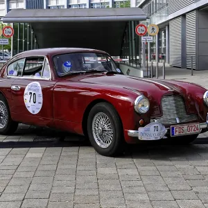 Austin Martin DB 2-4, Red classic car with elegant lines in an urban setting during an event