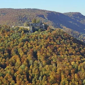 Autumn forest, view of Hohenurach Ruin and Alb ridge Autumn forest, view of Hohenurach Ruin and Alb ridge