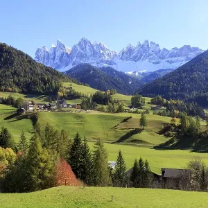 Autumn mountain landscape with a village surrounded by colourful trees Autumn mountain landscape with a village surrounded by colourful trees