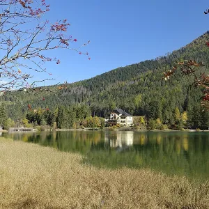 Autumnal alpine lake with clear water