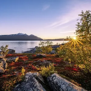 Autumnal fell landscape with lake Akkajaure and mountain range Akka Autumnal fell landscape with lake Akkajaure and mountain range Akka