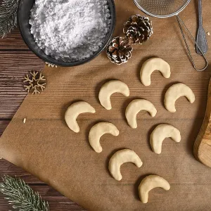 Baking traditional German or Austrian crescent shaped christmas cookies called Vanillekipferl'<br> Baking Baking traditional German or Austrian crescent shaped christmas cookies called Vanillekipferl'<br> Baking