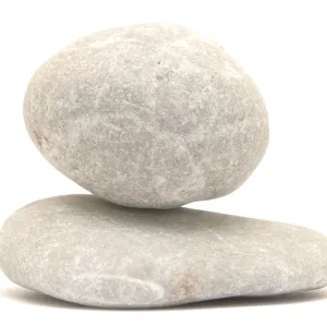 Balancing stone tower isolated on white background Balancing stone tower isolated on white background