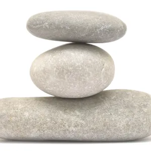 Balancing stone tower isolated on white background Balancing stone tower isolated on white background
