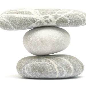 Balancing stone tower isolated on white background Balancing stone tower isolated on white background