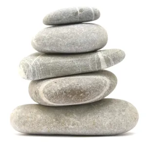 Balancing stone tower isolated on white background Balancing stone tower isolated on white background
