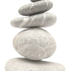 Balancing stone tower isolated on white background Balancing stone tower isolated on white background