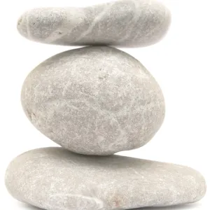 Balancing stone tower isolated on white background Balancing stone tower isolated on white background