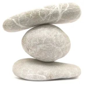 Balancing stone tower isolated on white background Balancing stone tower isolated on white background