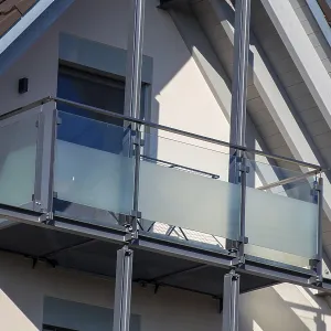 Balcony railing made of glass and stainless steel on a residential building