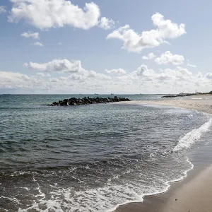 Baltic Sea beach with lighthouse in Skagen Baltic Sea beach with lighthouse in Skagen