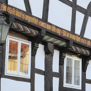 Banner on the facade of a 16th century half-timbered house Banner on the facade of a 16th century half-timbered house