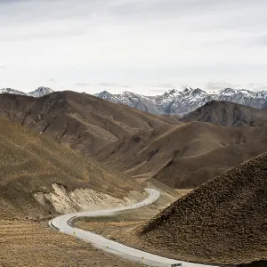 Barren mountain landscape with pass road