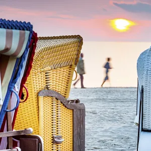 Beach chairs, walking people, Baltic Sea