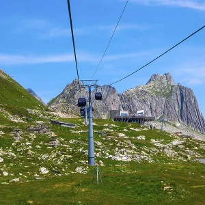 Beautiful Panoramic View over Mountain Peak in the Swiss Alps with Overhead Cable Car