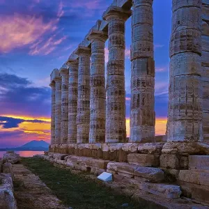 Beautiful sunset sky and ancient ruins of temple of Poseidon