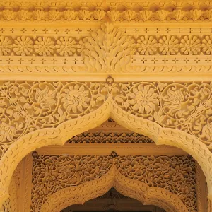 Beautifully carved top of arch door made by sandstones in temple at Amarsagar Lake