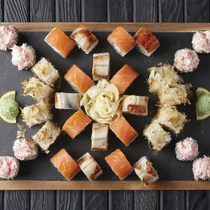 Big set of rolls served on stone plate