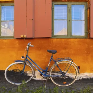 Bike leaning against the orange wall