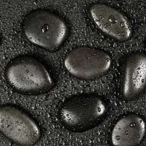 Several black basalt massage stones Several black basalt massage stones