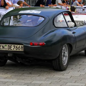 Black classic car with a unique shape at a car competition