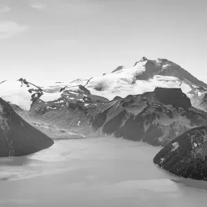 Black and white, Garibaldi Lake in front of mountain range with snow and glacier Black and white, Garibaldi Lake in front of mountain range with snow and glacier