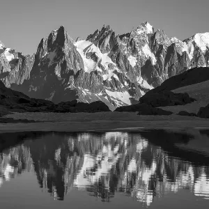 Black and white, mountain panorama with water reflection in Lac Blanc Black and white, mountain panorama with water reflection in Lac Blanc