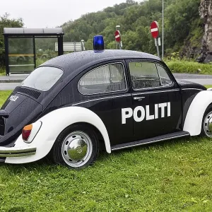 Black and white police patrol car with lettering Politi Black and white police patrol car with lettering Politi