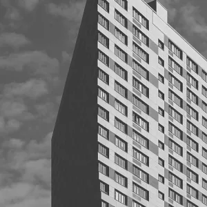 Black and White Skyscraper on the Cloudy Sky Background Black and White Skyscraper on the Cloudy Sky Background