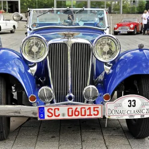 Blue classic classic car with distinctive headlights and nostalgic license plate Blue classic classic car with distinctive headlights and nostalgic license plate