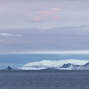 Blue hour, snow-capped mountains