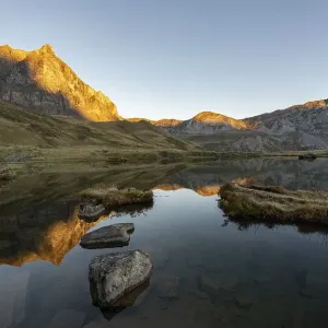 The Blue Lake at sunrise near Melchsee-Frutt on the Aa Alp in the Melch Valley The Blue Lake at sunrise near Melchsee-Frutt on the Aa Alp in the Melch Valley
