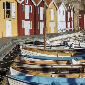 Boats and colourful boathouses in the harbour of Smoegen